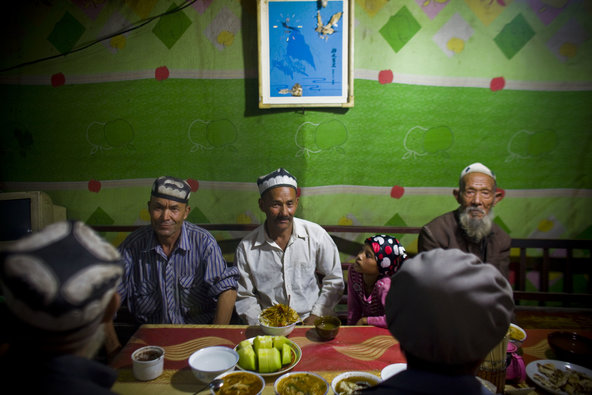 Shiho Fukada for The New York TimesUighurs in Hotan, a city in the Xinjiang region, gathering for dinner at the break of a Ramadan fast in 2010.
