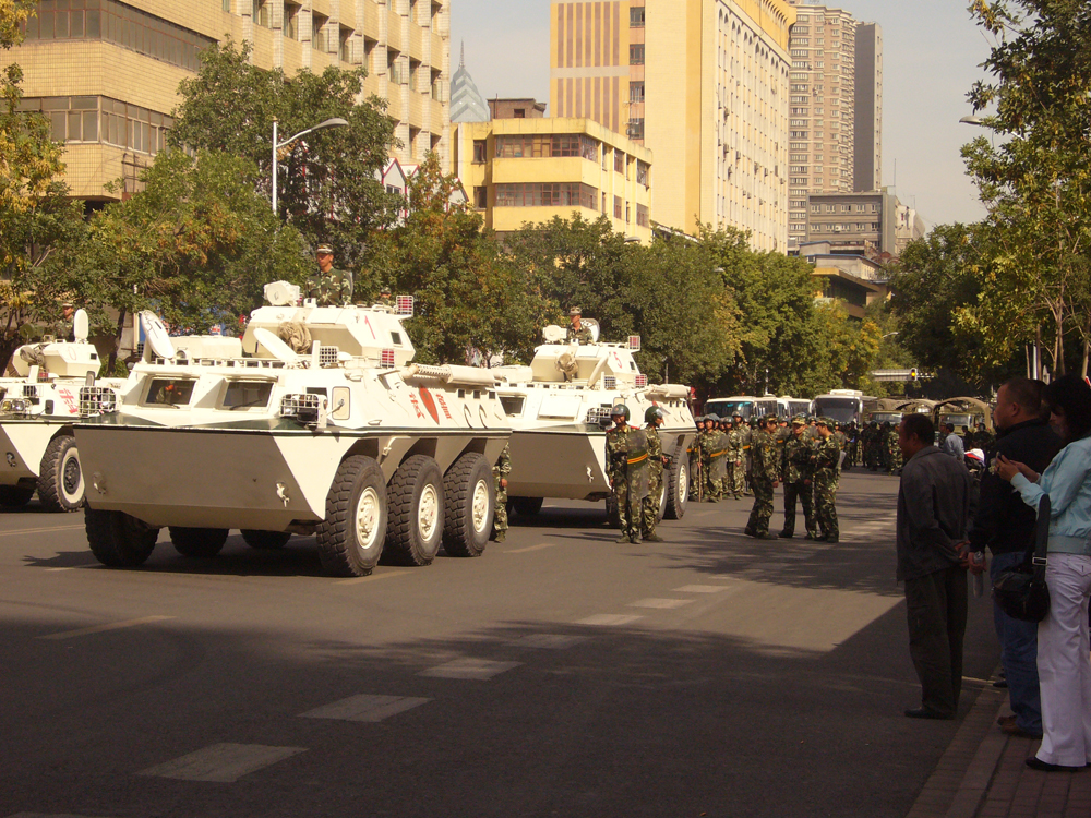 Armed Police soldiers and armored vehicles WZ-551 in the street of Urumqi in September 4, 2009. Days before and at the time, tens of thousands of civilians demonstrated around major places in the city, against a series of the hypodermic needle attacks starting in mid-August.