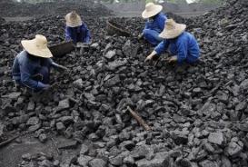 Chinese miners process coal from a mine in Huaibei, east China's Anhui province on July 13, 2010 (AFP/File)
