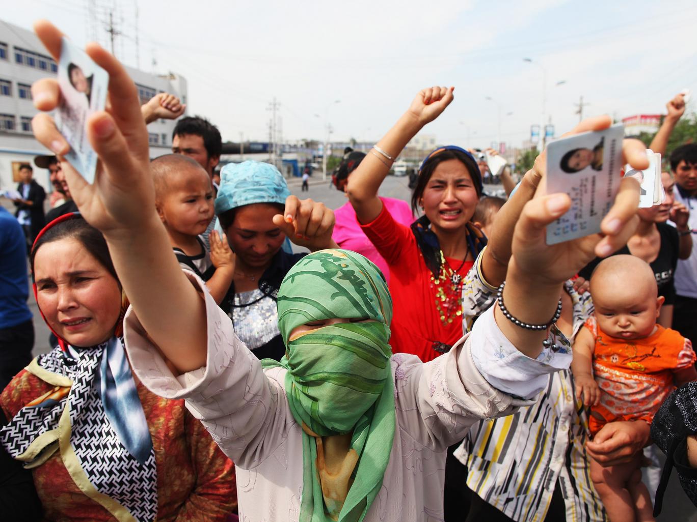 Uighur women protest against the Chinese government in Urumqi, the capital of Xinjiang Uighur autonomous region Getty