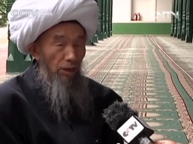Screen grab from CCTV shows Imam Jume Tahir being interviewed by the Chinese state broadcaster, April 30, 2013. 