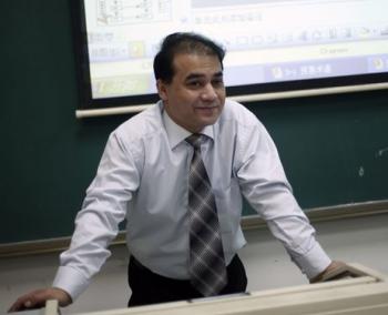 Professor Ilham Tohti lecturing in a classroom at Minzu University of China, Beijing