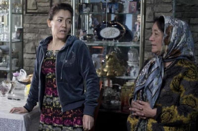 Tohti's wife Guzaili Nu'er, left, and mother Nasipuhan, said the professor does not support Uighur separatism [AP]