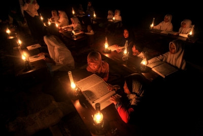Students in central Java read the Koran outdoors by oil lamp during Ramadan. Indonesian Muslims have expressed anger over reports that Muslims in China faced restrictions on celebrating Ramadan. (Maulana Surya/Antara Foto via Reuters)