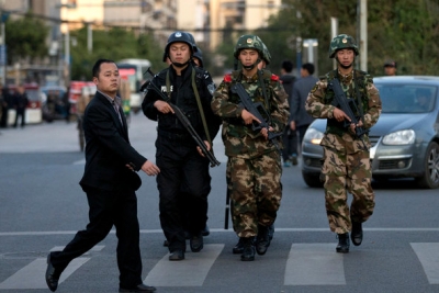 Paramilitary police patrolled a street near the Kunming train station after a deadly knifing rampage on March 1 that Chinese officials blamed on Xinjiang separatists.