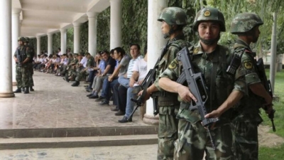 A file picture of security forces on patrol in Xinjiang. Photo: Reuters