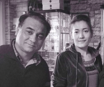 Ilham Tohti and his wife in a photo sent to RFA's Uyghur Service via WeChat on Jan 13, 2014, two days before his detention. Photo: RFA