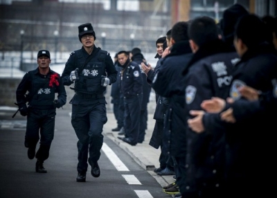 A SWAT team trains in Xinjiang's capital Urumqi, Dec. 16, 2013.