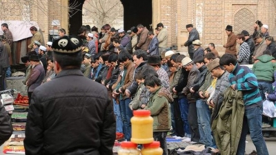 Backlash: Ulghur worshippers at Friday prayer at the central mosque in Hotan. Photo: Sanghee Lee 