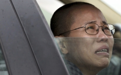 Liu Xia, wife of imprisoned Nobel Peace Prize winner Liu Xiaobo, weeps in anguish after her brother was jailed in June. Photo: AP